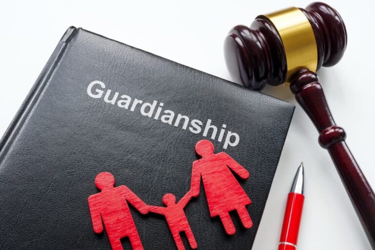Black book titled "Guardianship" with red family figures, a red pen, and a wooden judge's gavel.